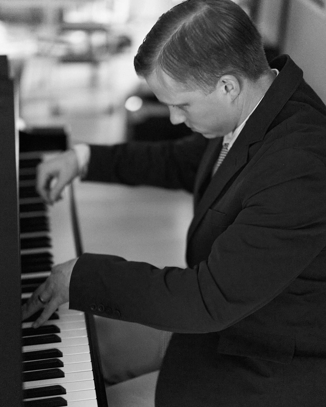 Joe Infurchia at the piano, black and white